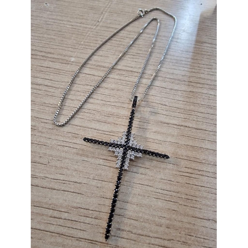 249 - 18ct White Gold (.750) Cross Pendant Encrusted with Clear & Black Stones, (Approx. 6.9g),  on 9ct Wh... 