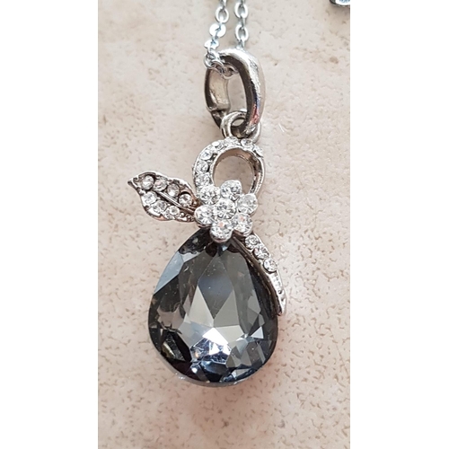 500 - High Ornate Silver Pendant with Large Crystal in Tear Shaped and Quantity of Small Clear Crystals To... 