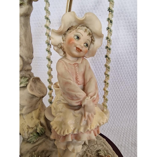 250 - Capodimonte Table / Side Lamp with Girl on Tree Swing, over Wooden Base, Signed & Stamped 'Florence'