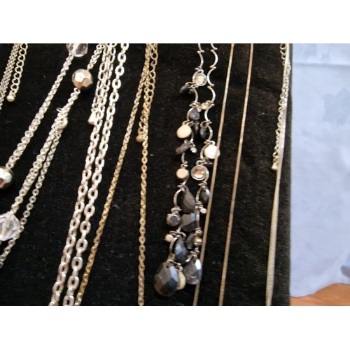 10 - Collection of 15 x Assorted Necklaces and a Bracelet on Free-Standing Black Velvet Padded Display