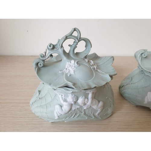 150 - A Pair of Rare Pale Green Rococo Baluster Bowls and Covers, Applied with White Cherubs (1 x Lid with... 