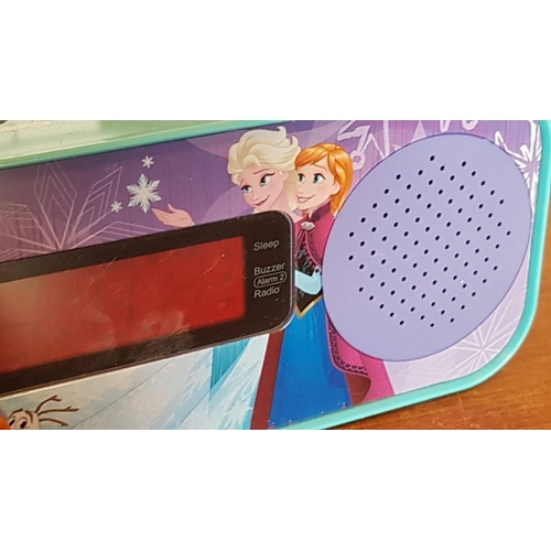 64 - 'Frozen' Alarm Clock Radio, Working When Lotted