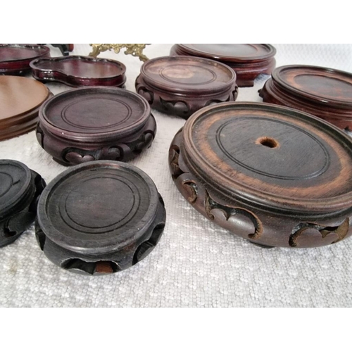 302 - Large Qty of Carved Wood Oriental Bases / Plinths, Together with Plate Stands and Decorative Brass P... 