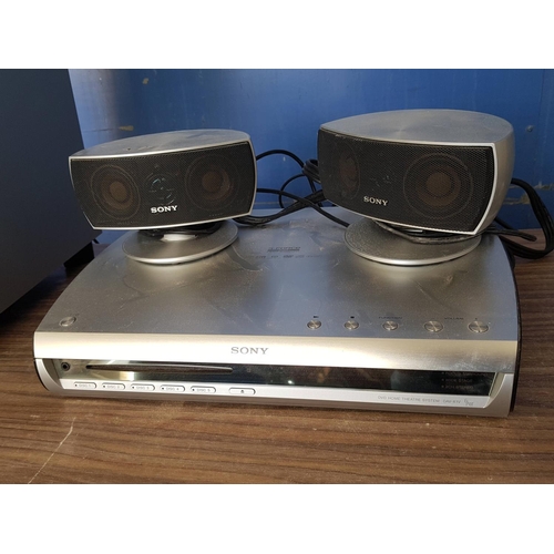 562 - 2 x Sony DVD Home Theatre System DAV-X1V (Player, Woofer, Speakers with R/C, Cables)