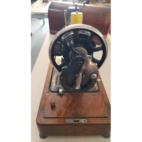 20 - Antique Cast Iron Singer Sewing Machine, Circa 1922, Hand Cranked, in Wooden Case with Numerous Atta... 