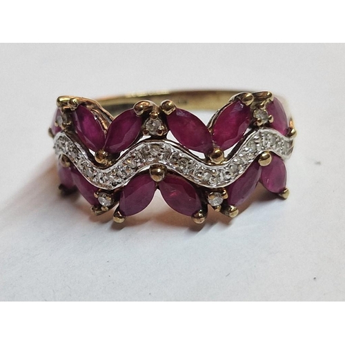 168 - 9ct Gold Ruby and Diamond Ring; Attractive Angled Arrangement of 12 x Oval Cut Rubies with Qty of Di... 