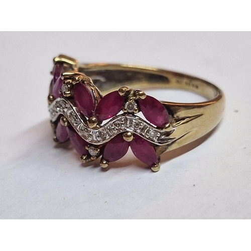 168 - 9ct Gold Ruby and Diamond Ring; Attractive Angled Arrangement of 12 x Oval Cut Rubies with Qty of Di... 