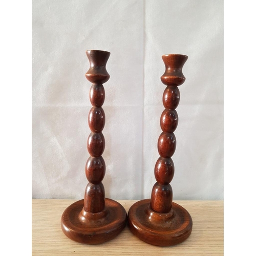 39 - 7 'Treen' Items - 2 Candlesticks (25cm High). Large Candle Holder, 3 Carved Lidded Bowls and Round P... 