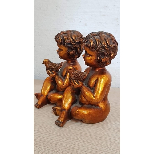 249 - 2 x Sweet Putti Figurines, Gold Tone Little Boys Holding Birds, (Approx. H: 20cm each), Repair noted... 