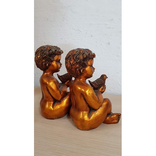 249 - 2 x Sweet Putti Figurines, Gold Tone Little Boys Holding Birds, (Approx. H: 20cm each), Repair noted... 