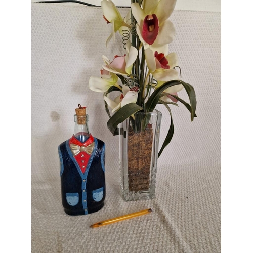 95 - Glass Vase with Artificial Flowers, Together with Glass Bottle with Waistcoat Design and Cork Stoppe... 