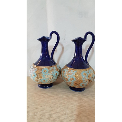 19 - Pair Royal Doulton cobalt blue ewers with tapestry design in gold and pale blue – 24cm high