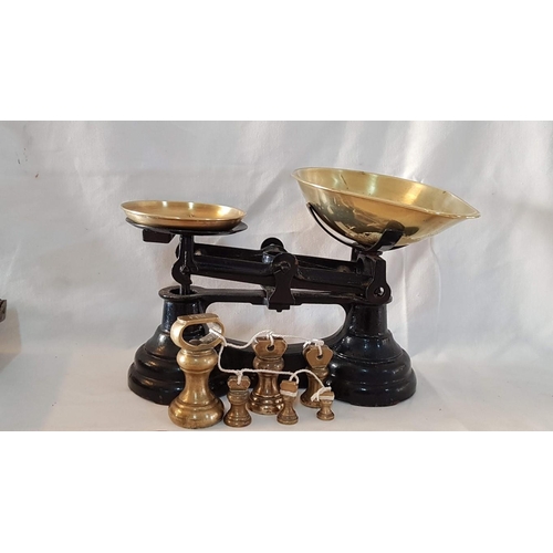 28 - Heavy cast iron set vintage kitchen scales with brass pans and set of 6 brass bell weights.