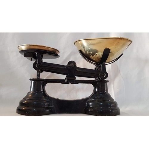 28 - Heavy cast iron set vintage kitchen scales with brass pans and set of 6 brass bell weights.