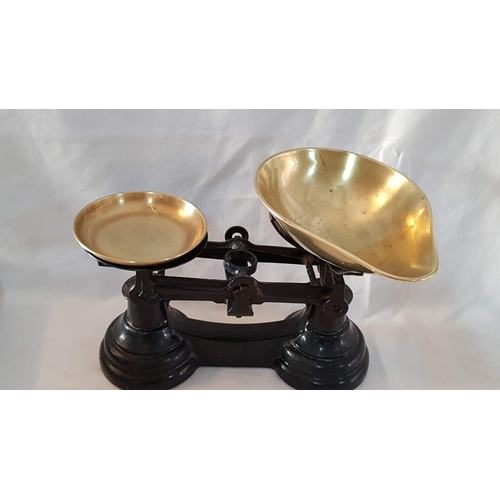 28 - Heavy cast iron set vintage kitchen scales with brass pans and set of 6 brass bell weights.