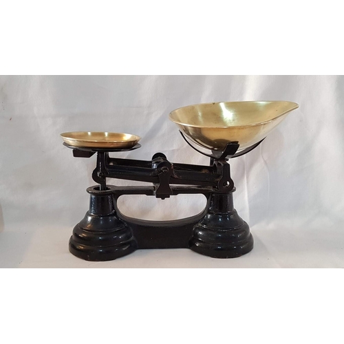 28 - Heavy cast iron set vintage kitchen scales with brass pans and set of 6 brass bell weights.