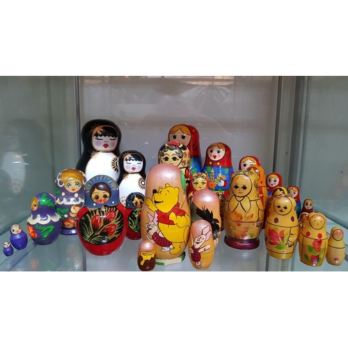 79 - 7 sets Matryoshka Russian stacking dolls – 1 x 7 pcs, 2 x 3 pcs, 4 x 4 pcs and 2 porcelain dolls – 1... 