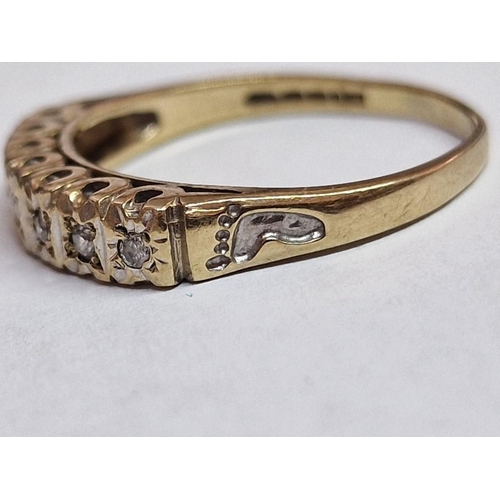 105B - 9ct Gold and 7-Diamond Ring, with 'Foot Prints' Engraved Shoulders, (Approx. Size: Q, 2.5g)