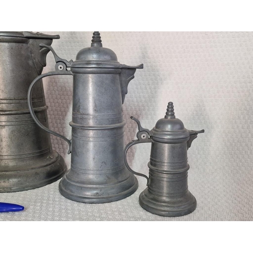 34 - Graduating Set of Pewter Lidded Jugs (one missing base), Plus another Similar and White Metal Lamp (... 