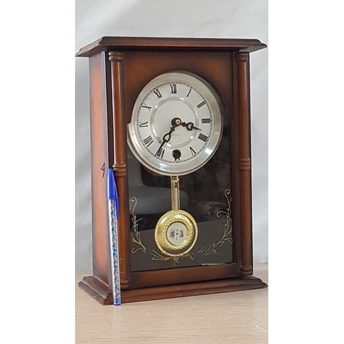 42 - Mechanical 15 day Mantle/wall hanging clock with pendulum and key, white face with Roman numerals. W... 