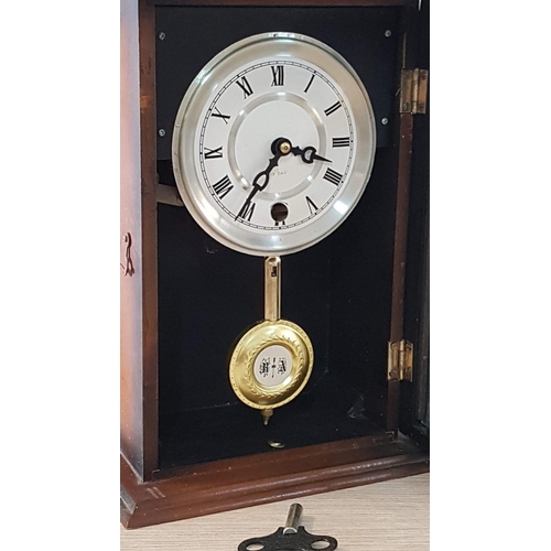 42 - Mechanical 15 day Mantle/wall hanging clock with pendulum and key, white face with Roman numerals. W... 