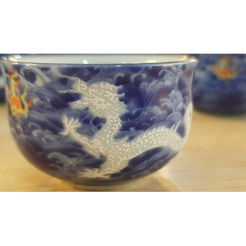 17 - Japanese service of Tea bowls, sake cups with water jug, and strainer in teapot in ‘Deep Blue Dragon... 