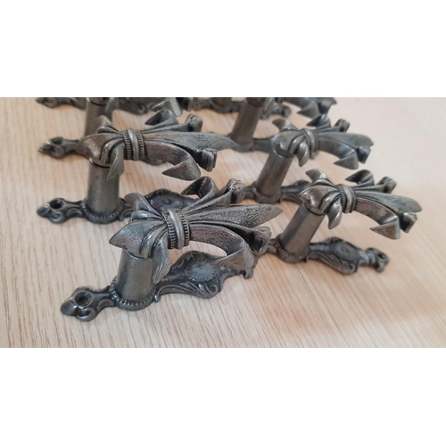 357 - 'Fleur De Lis' Expandable Sword Hangers, Collection of 16 Pcs, Cast Metal and Feature a Darkened Sil... 