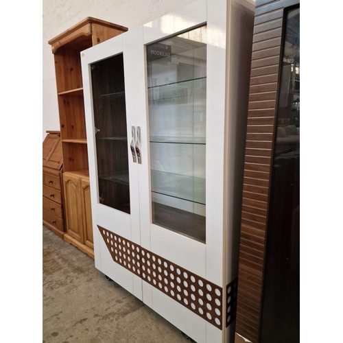 310 - Modern Gloss White Double Door Display Cabinet with Twisted Chrome Handles and Pierced Wood Lower De... 