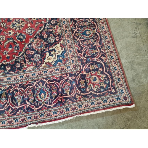 321 - Large Persian Style Carpet in Traditional Pattern with Centre Medallion and Decorative Border in Red... 