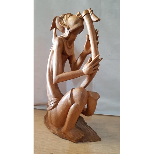 215 - Balinese Art Deco Wooden Sculpture, A Flutist, (Approx. H: 50cm)