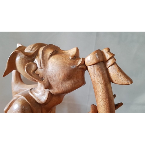 215 - Balinese Art Deco Wooden Sculpture, A Flutist, (Approx. H: 50cm)