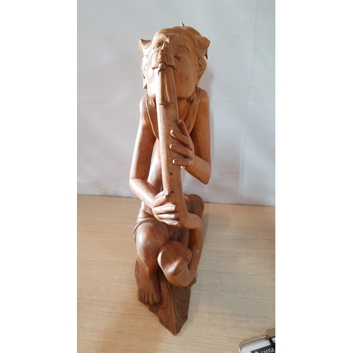 215 - Balinese Art Deco Wooden Sculpture, A Flutist, (Approx. H: 50cm)