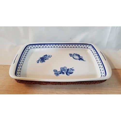 365 - Blue and White Ceramic Rectangular Dish in Wicker Basket. (Approx. 46cm x 28cm x 5cm)