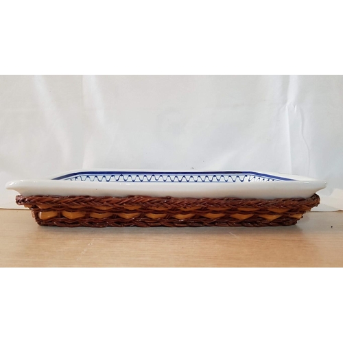 365 - Blue and White Ceramic Rectangular Dish in Wicker Basket. (Approx. 46cm x 28cm x 5cm)