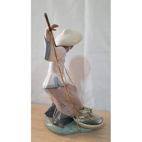 79 - Lladro 'Fish a Plenty' Porcelain Figurine, Made in Spain, (Oriental Fisherman), 1982, H:25cm.