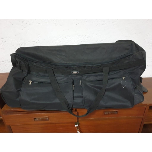 267 - Very Large Charlie Sport Travel Holdall On Wheels With Foldaway Handle 100cm x 40cm, Together With A... 