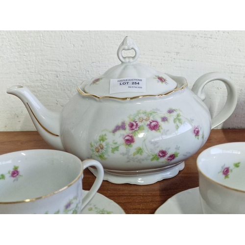 254 - Decorative Czechoslovakian Tea Set with Floral Pattern and Gold Trim; Tea Pot, Lidded Sugar Bowl, Mi... 