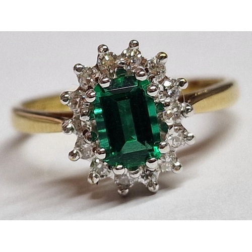 316A - 18ct Gold, Emerald and Diamond Ring; Oval Cut Emerald with 14 x Surrounding Round Cut Diamonds, Set ... 