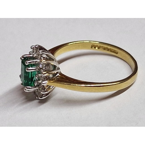 316A - 18ct Gold, Emerald and Diamond Ring; Oval Cut Emerald with 14 x Surrounding Round Cut Diamonds, Set ... 