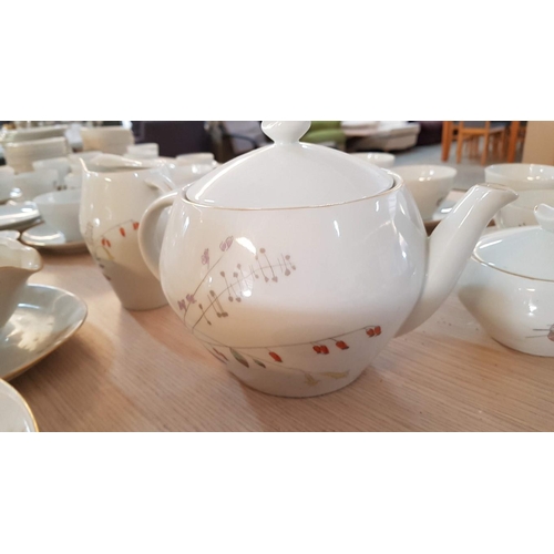 385 - ''Jarolina'' Polish Porcelain Dinner Set with Delicate Pattern of Meadow Flowers and Gold Rim.