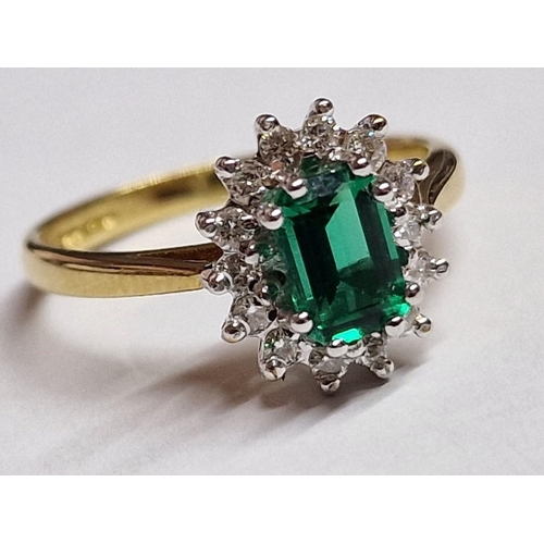 102A - 18ct Gold, Emerald and Diamond Ring; Oval Cut Emerald with 14 x Surrounding Round Cut Diamonds, Set ... 