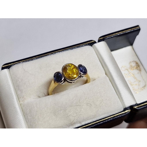 100 - 18ct Gold and Sapphire Ring; Central Oval Cut 1.75ct Yellow Sapphire, with Pair of Adjoining Oval Cu... 