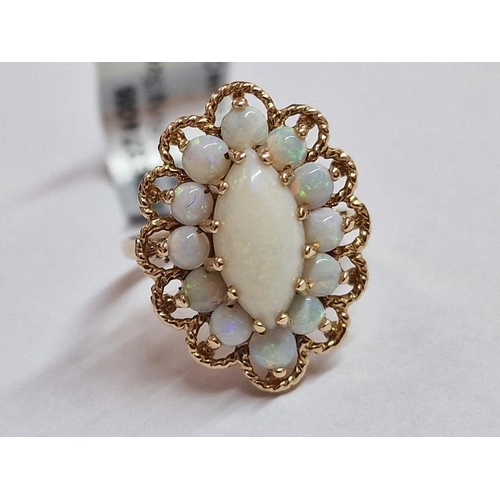 101 - 9ct & Opal Ring; Marquise Cluster of Opals (Large Oval Shape Centre with 12 x Surrounding), in Ornat... 