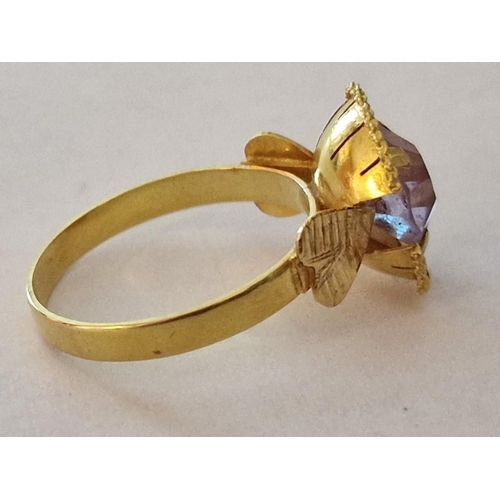 158 - 18ct Gold Ring with Large Light Purple Tone Round Stone in Raised Surround with Leaf Design Shoulder... 