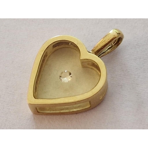 89 - 15ct Gold Heart Shaped Pendant with Glass Front & Back and Floating Clear Stone, (Approx. H: 18mm, 1... 