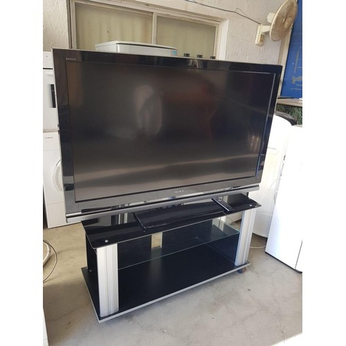 585 - Sony 52'' LCD Digital Colour TV, (Model: KDL-52W4000) with Remote Control, Together with Modern Blac... 