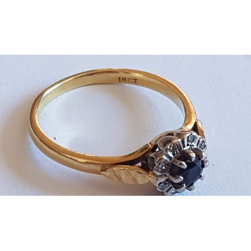 136 - 'Daisy' 18ct Gold Ring, Single Sapphire Stone (?)Surrounded by 8- Diamonds, Approx. 3.7g Size