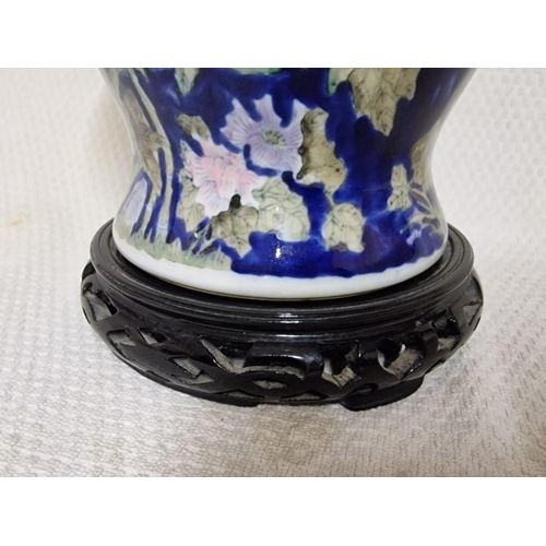 563 - Large Chinese Lidded Jar with Floral Pattern and Carved Wood Base, (Approx. H: 39cm)