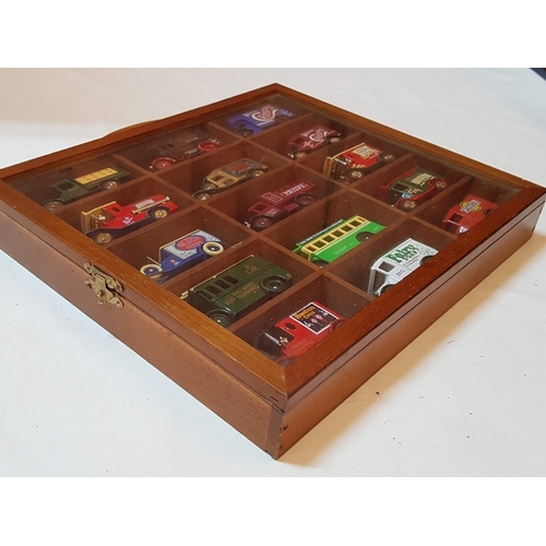 12 - Wooden glass fronted display case containing 15 x Lledo die cast commercial vehicles – unit is 33cm ... 