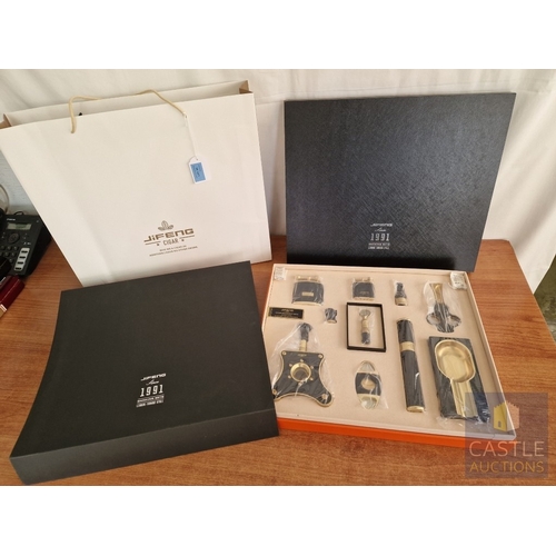 54 - JiFENG 'Cigar Presidents Sets'; An Impressive Cigar Accessory Gift Set Comprising Brass Colour Metal... 